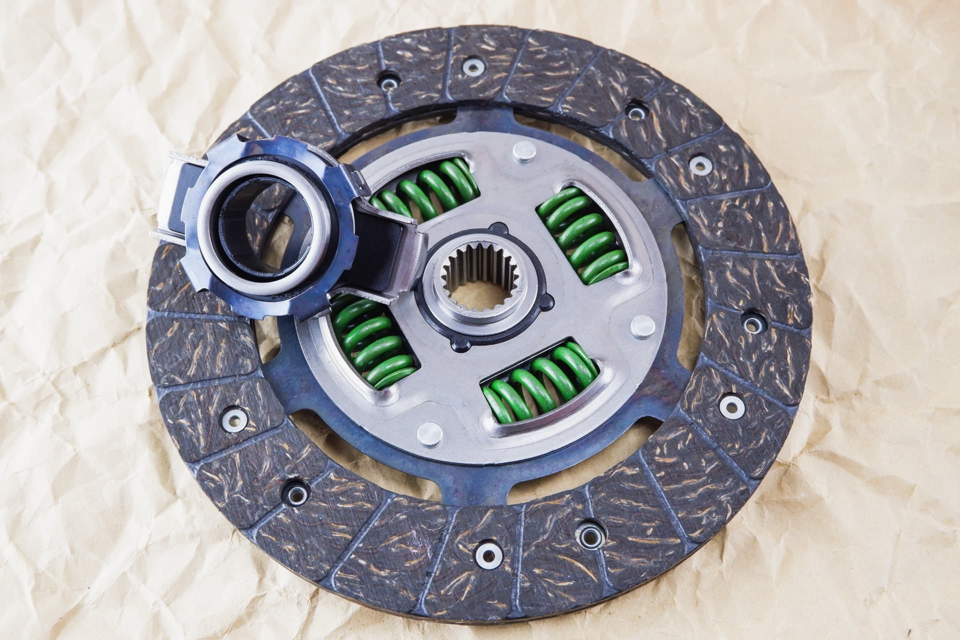 Technician adjusting clutch pedal free play in a vehicle