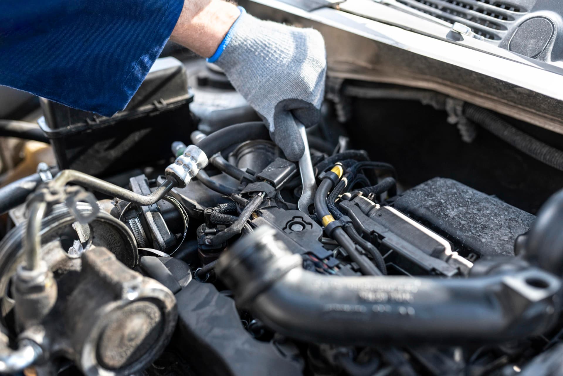 Technician inspecting fuel lines and pressure system